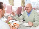 Father and Son Having Dinner