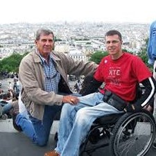 Man with Son In Wheelchair