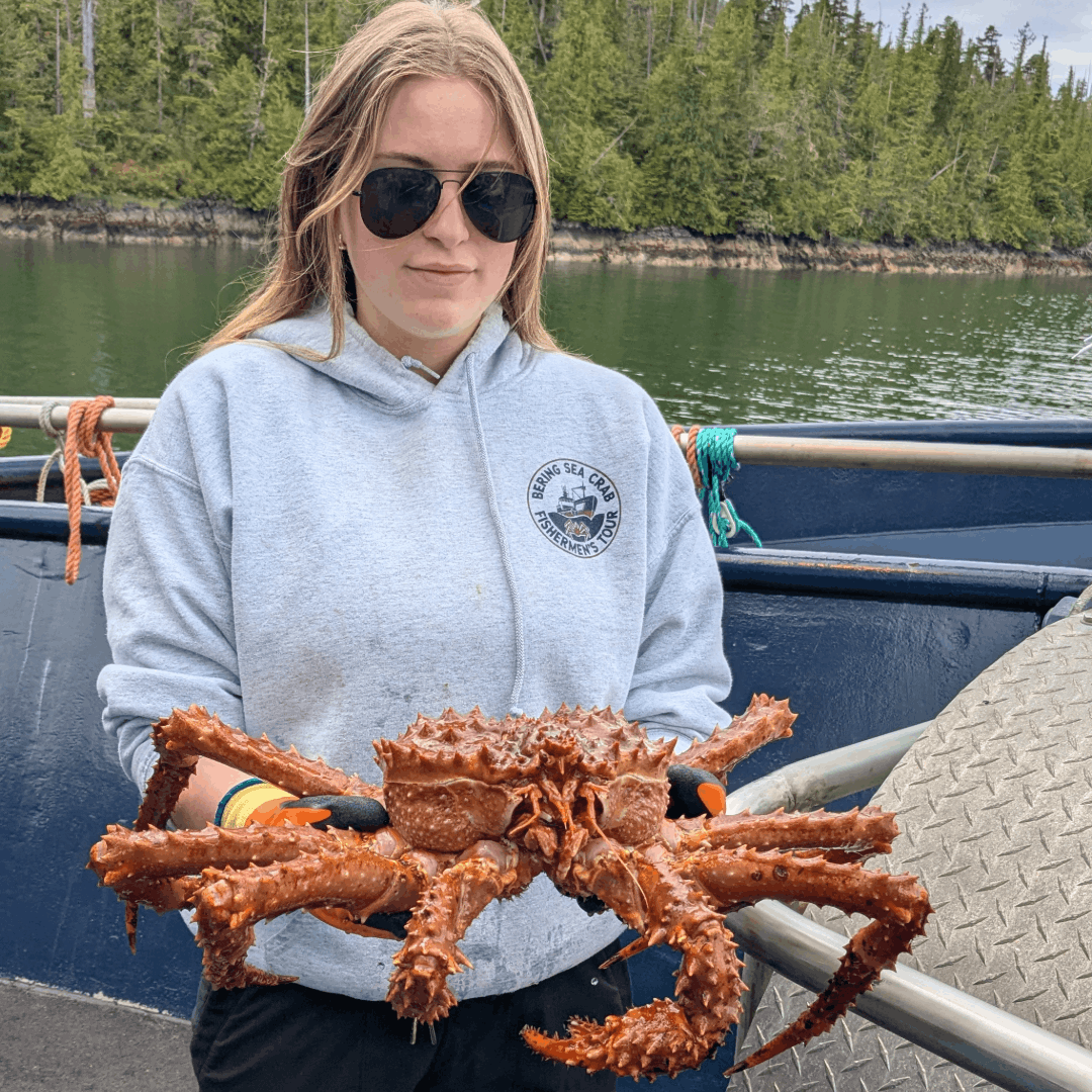 Woman holding a crab